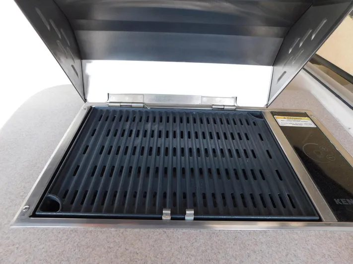 Sea Y'all Yacht Photos Pics Built-in grill on 2004 Regal Commodore 3860 boat, open lid, black grates.