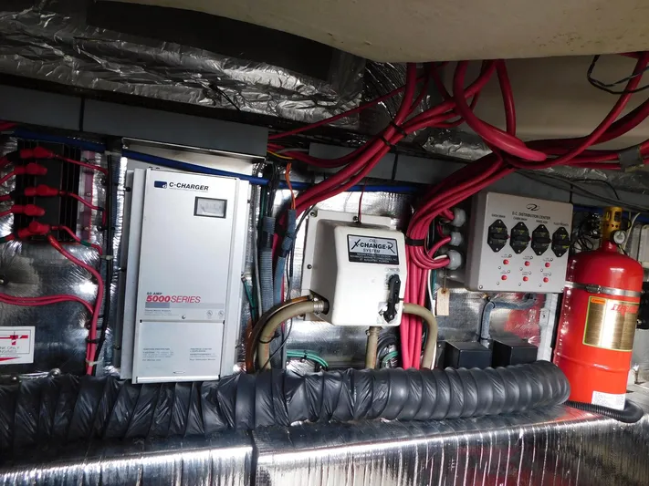 Sea Y'all Yacht Photos Pics Engine room of 2004 Regal Commodore 3860 with electrical systems and fire extinguisher.