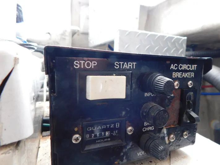 Sea Y'all Yacht Photos Pics Control panel of a 2004 Regal Commodore 3860 boat with start, stop, and circuit breaker switches.