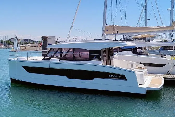  Yacht Photos Pics 2025 Fountaine Pajot MY4.S motor yacht docked in a marina.