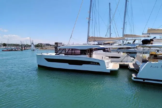  Yacht Photos Pics 2025 Fountaine Pajot MY4.S yacht docked in a marina under clear blue skies.