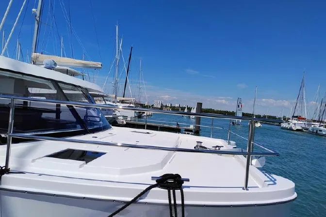  Yacht Photos Pics 2025 Fountaine Pajot MY4.S yacht docked in a sunny marina.