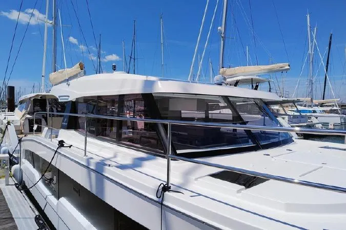  Yacht Photos Pics 2025 Fountaine Pajot MY4.S yacht docked at marina under clear blue sky.