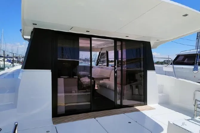  Yacht Photos Pics 2025 Fountaine Pajot MY4.S yacht with sleek glass doors and modern interior design.