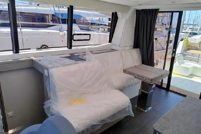  Yacht Photos Pics Interior of 2025 Fountaine Pajot MY4.S yacht with modern seating and table.