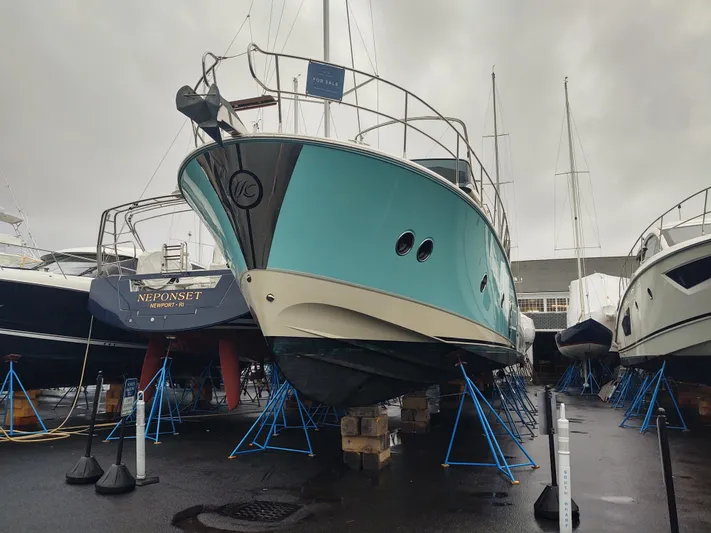Blue Yacht Photos Pics 2019 Monte Carlo MC5 yacht on stands in a boatyard.