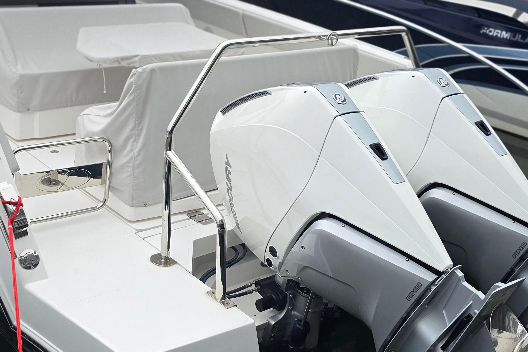 2025 Schaefer V33 boat with dual Mercury outboard engines, sleek design.