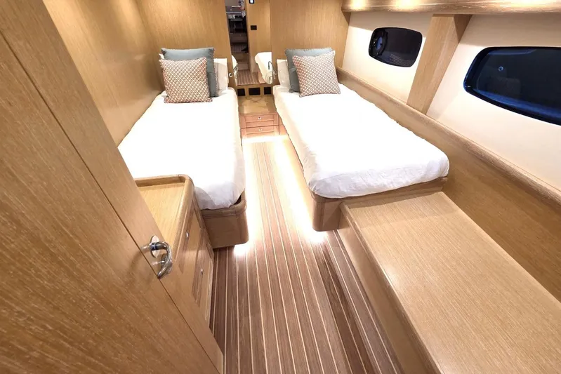 Menorquin 48 Fly Yacht Photos Pics Luxurious 2026 Sasga Yachts Menorquin 48 cabin with twin beds and elegant wood finish.