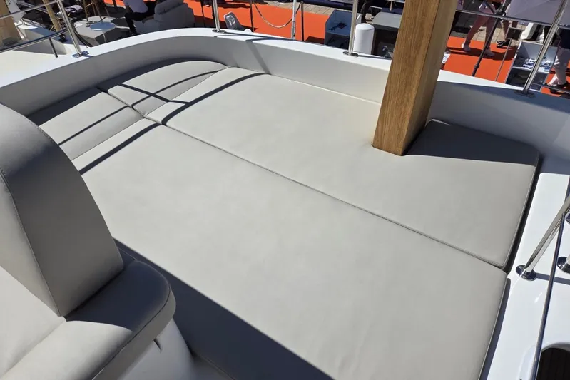 Menorquin 48 Fly Yacht Photos Pics Luxurious sunbathing area on 2026 Sasga Yachts Menorquin 48, featuring comfortable cushions and sleek design.