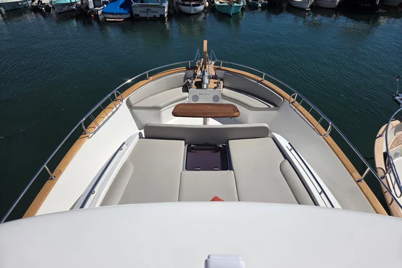 Menorquin 48 Fly Yacht Photos Pics Bow view of 2026 Sasga Yachts Menorquin 48, featuring spacious seating and elegant design.