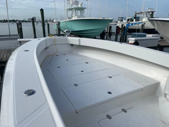 Last Resort Yacht Photos Pics 2013 Bahama Open Fisherman boat docked at marina, spacious deck view.