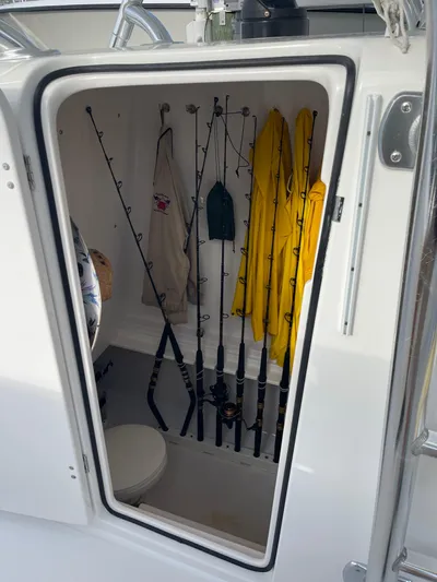 Last Resort Yacht Photos Pics 2013 Bahama Open Fisherman storage with fishing rods and gear.