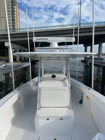 Last Resort Yacht Photos Pics 2013 Bahama Open Fisherman boat docked under a bridge, featuring Garmin equipment.