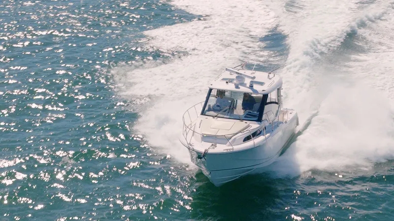 Salt Yacht Photos Pics Boston Whaler 325 Conquest 2023 cruising on open water.