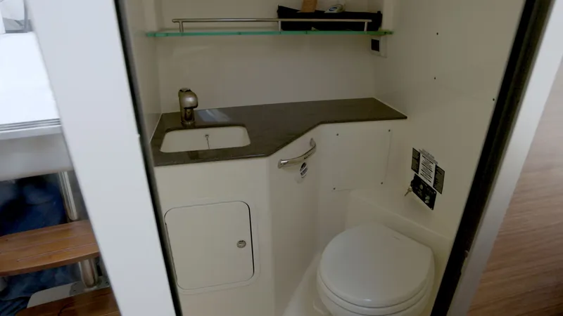 Salt Yacht Photos Pics Interior of 2023 Boston Whaler 325 Conquest with sink and toilet.