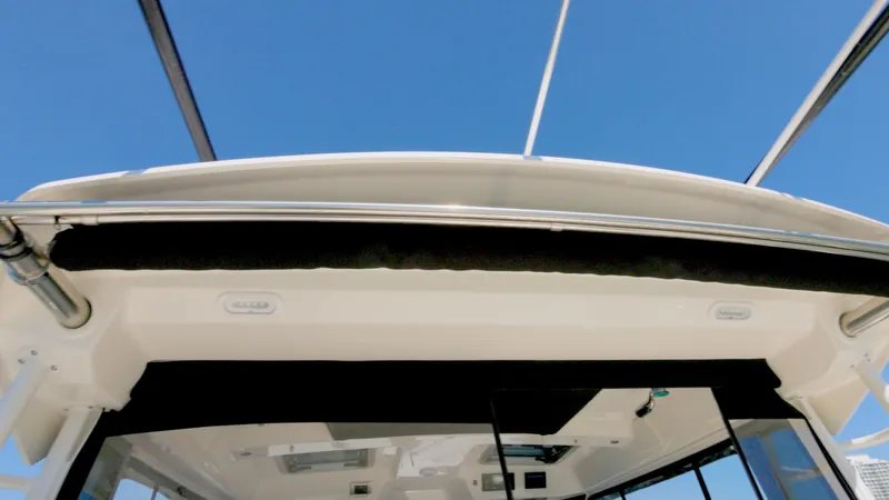 Salt Yacht Photos Pics Boston Whaler 325 Conquest 2023, boat deck under blue sky.
