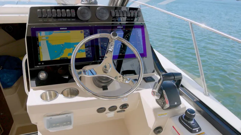 Salt Yacht Photos Pics 2023 Boston Whaler 325 Conquest helm with advanced navigation systems.