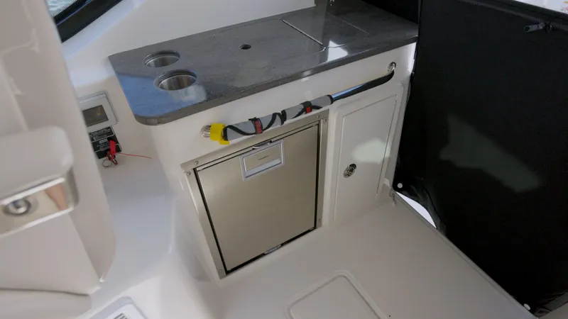 Salt Yacht Photos Pics Interior of 2023 Boston Whaler 325 Conquest with storage and countertop.