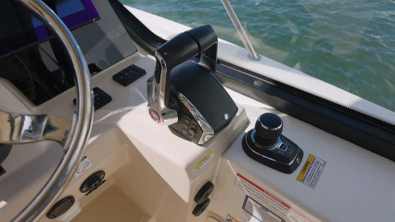 Salt Yacht Photos Pics Helm console of 2023 Boston Whaler 325 Conquest on water.