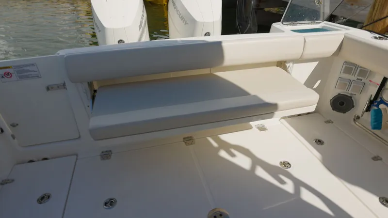 Salt Yacht Photos Pics Seating area of 2023 Boston Whaler 325 Conquest with engines.