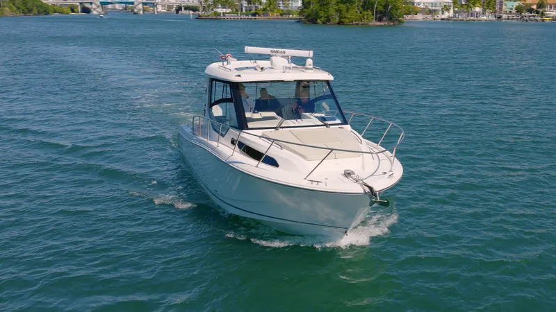 Salt Yacht Photos Pics 2023 Boston Whaler 325 Conquest on open water.