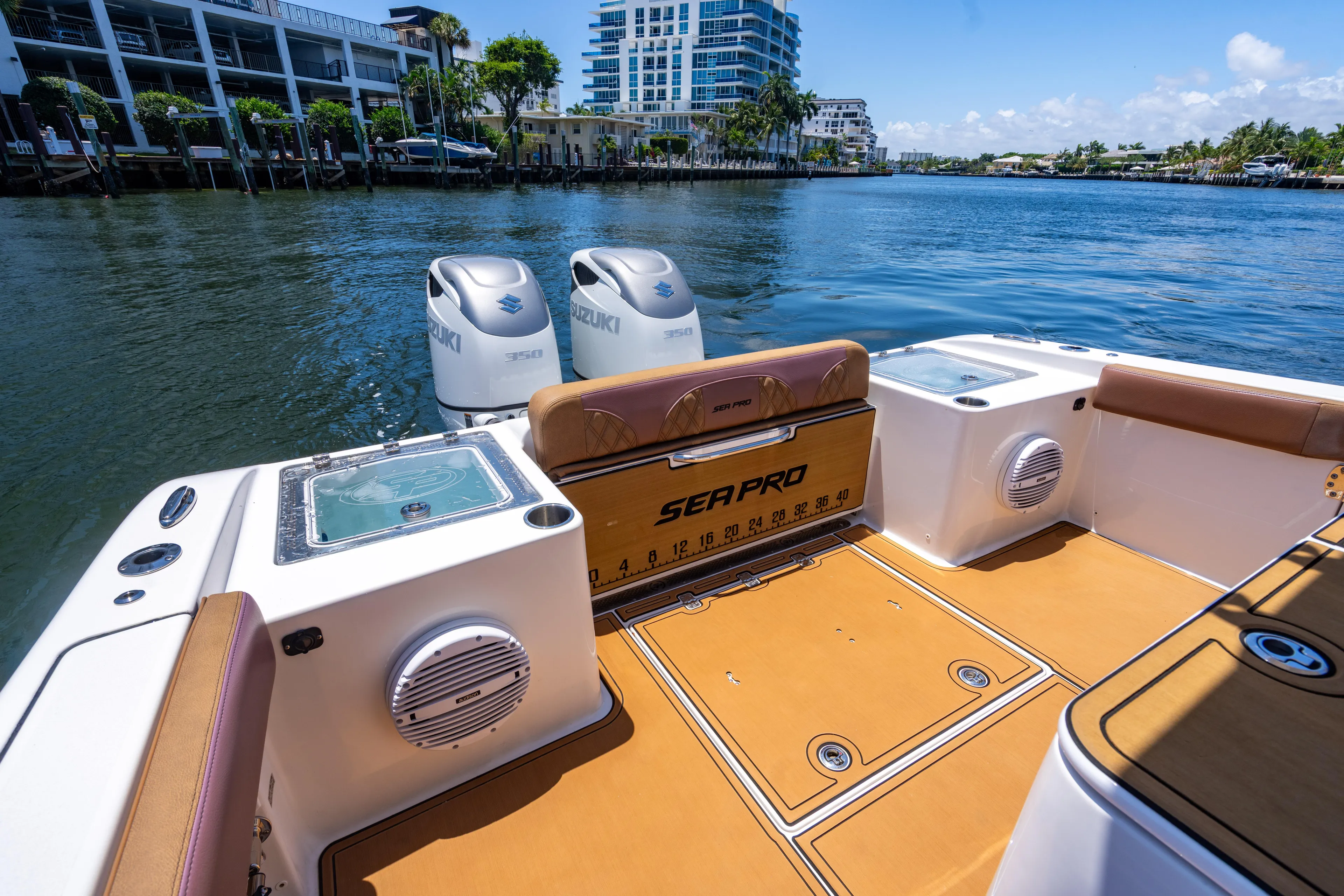  Yacht Photos Pics 2023 Sea Pro 320 DLX Offshore boat interior with dual engines on a sunny day.