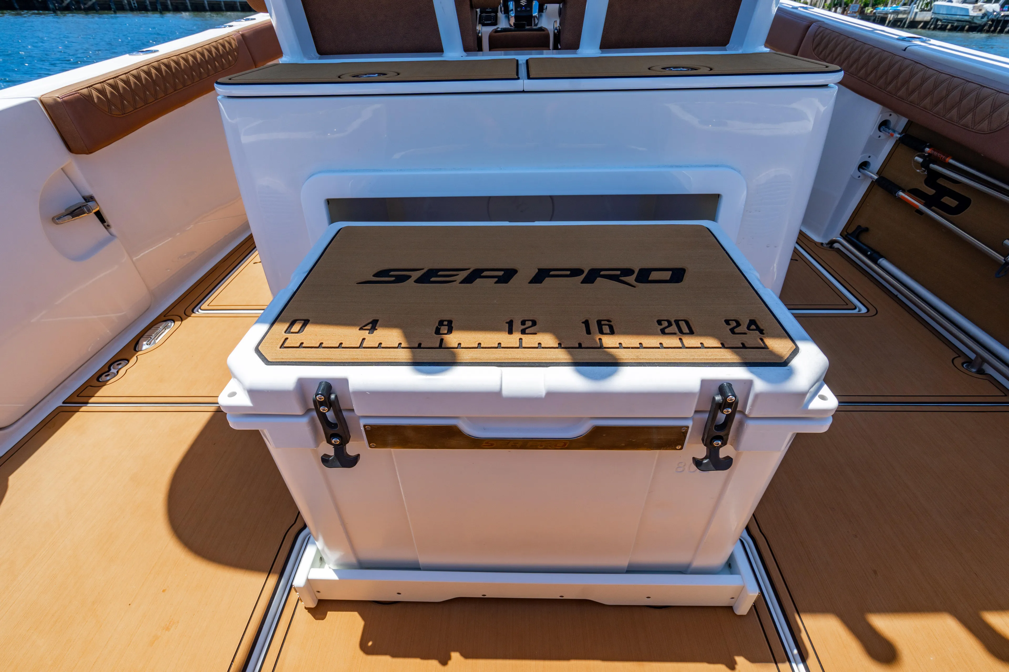  Yacht Photos Pics 2023 Sea Pro 320 DLX Offshore boat interior with branded cooler and measuring scale.