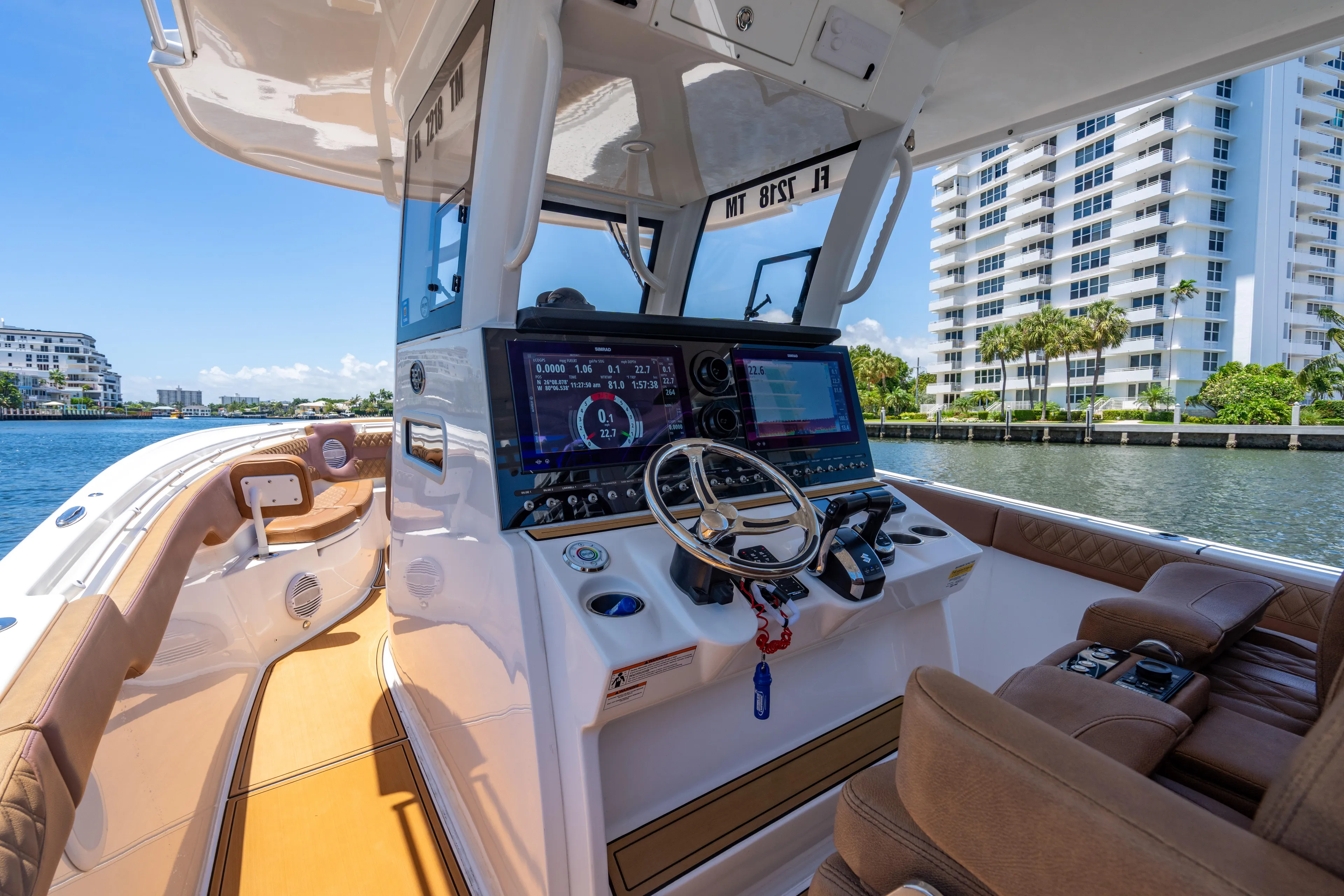  Yacht Photos Pics 2023 Sea Pro 320 DLX Offshore boat interior with modern dashboard and waterfront view.