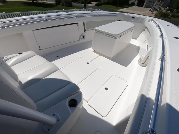  Yacht Photos Pics 2019 Invincible 39 CC boat interior with seating and storage compartments.