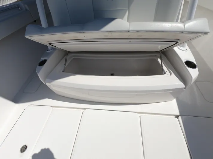  Yacht Photos Pics Open storage compartment on 2019 Invincible 39 CC boat with cushioned seating.