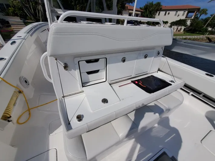 Yacht Photos Pics 2019 Invincible 39 CC boat with white seating and storage compartments.