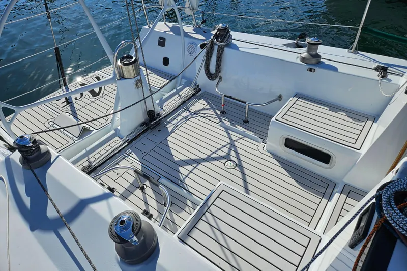 Ace Yacht Photos Pics Cockpit of 2001 Farr 395 sailboat with clean deck and winches, docked on water.