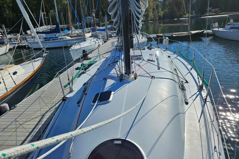 Ace Yacht Photos Pics Sailboat docked at marina, Farr 395 model, 2001, surrounded by other boats.