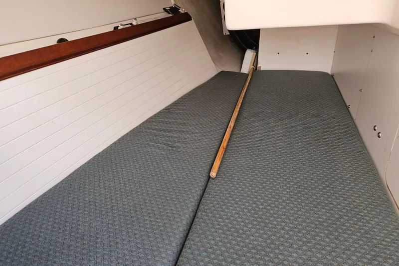 Ace Yacht Photos Pics Interior cabin of a 2001 Farr 395 sailboat with cushioned seating.