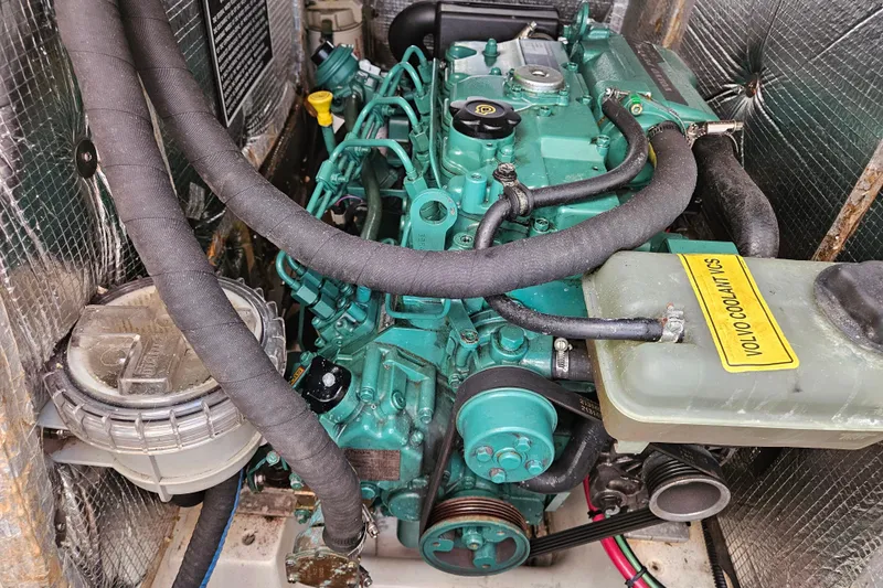 Ace Yacht Photos Pics Engine compartment of a 2001 Farr 395 sailboat with visible Volvo components.