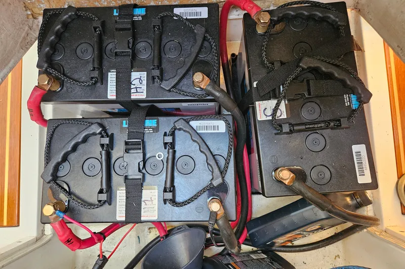 Ace Yacht Photos Pics Four marine batteries in a Farr 395 yacht, 2001 model, with red and black cables.