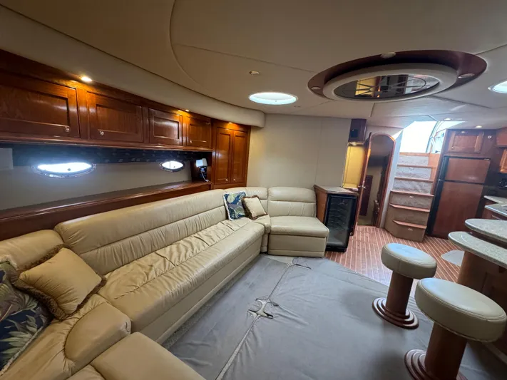  Yacht Photos Pics Luxurious interior of 2003 Cruisers Yachts 540 Express with plush seating and elegant wood finishes.