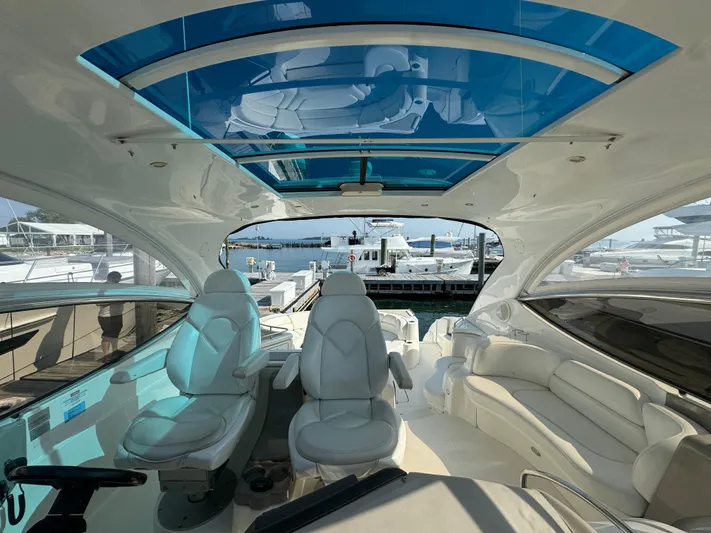  Yacht Photos Pics Luxurious 2003 Cruisers Yachts 540 Express interior with plush seating and panoramic views.