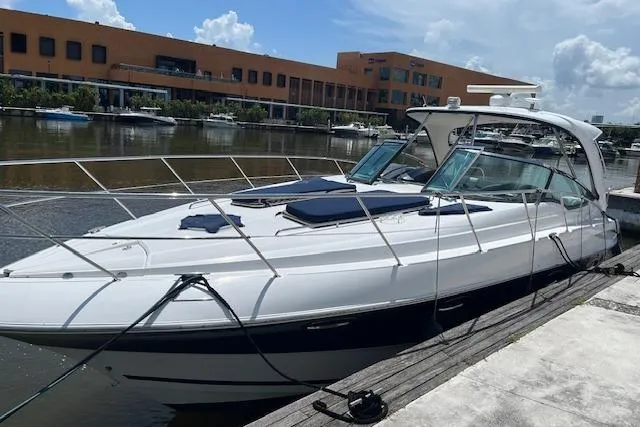  Yacht Photos Pics 2008 Doral Medditerra yacht docked at marina, sunny day, modern architecture in background.