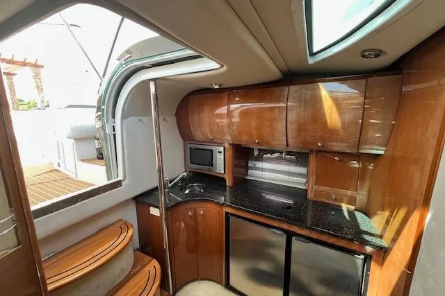  Yacht Photos Pics 2008 Doral Medditerra yacht interior with wooden cabinetry and modern kitchen amenities.