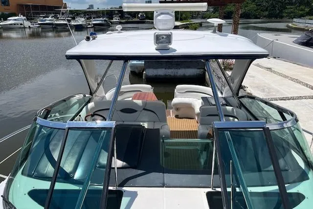  Yacht Photos Pics 2008 Doral Medditerra boat with spacious deck and seating, docked at marina.