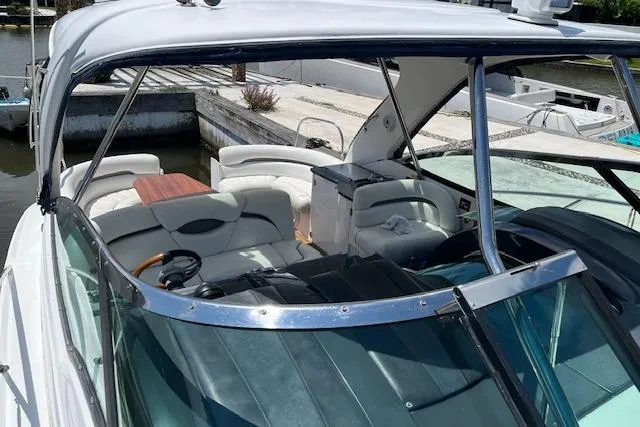  Yacht Photos Pics 2008 Doral Medditerra boat with spacious seating and sleek design, docked at marina.