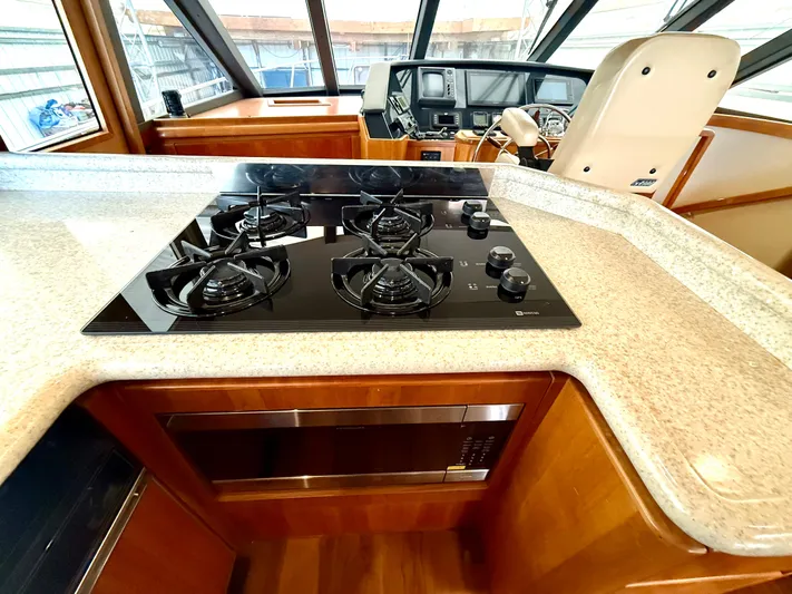  Yacht Photos Pics Pilothouse kitchen with stove in 2001 West Bay Sonship 58 yacht.