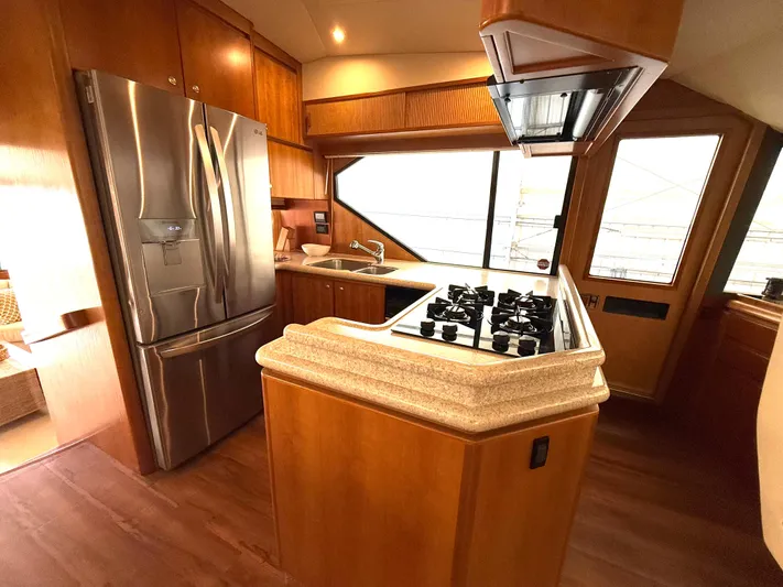  Yacht Photos Pics Luxurious kitchen in 2001 West Bay Sonship 58 Pilothouse yacht with modern appliances.