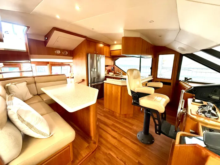  Yacht Photos Pics Luxurious 2001 West Bay Sonship 58 Pilothouse interior with modern kitchen and seating area.