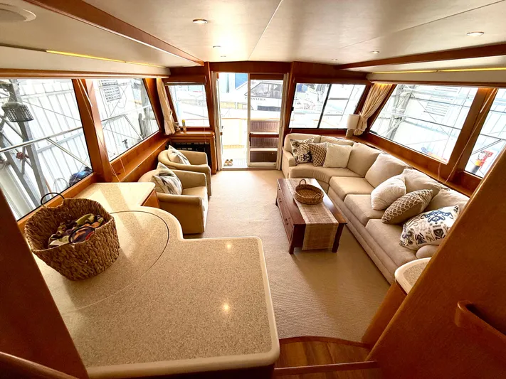  Yacht Photos Pics Luxurious interior of 2001 West Bay Sonship 58 Pilothouse yacht with elegant seating and decor.