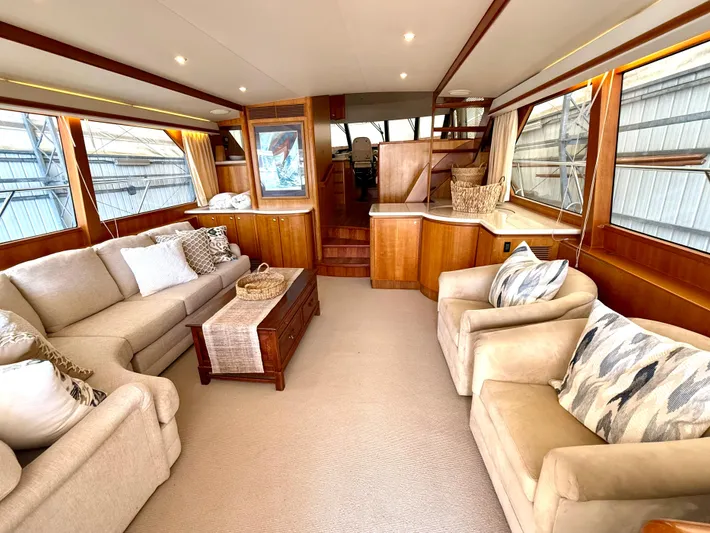  Yacht Photos Pics Luxurious interior of 2001 West Bay Sonship 58 Pilothouse yacht with elegant seating and wood accents.
