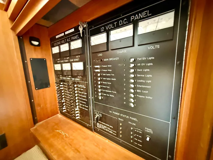  Yacht Photos Pics Electrical panel of 2001 West Bay Sonship 58 Pilothouse yacht, featuring AC and DC controls.