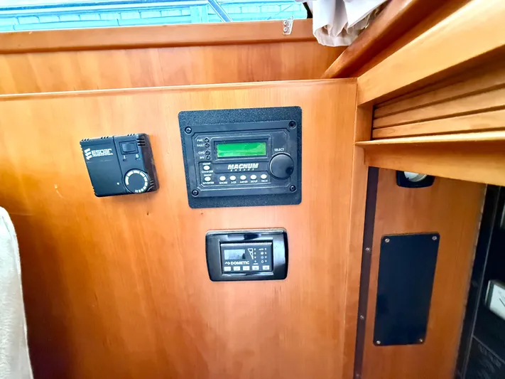  Yacht Photos Pics Control panel on 2001 West Bay Sonship 58 Pilothouse yacht, featuring various electronic devices.