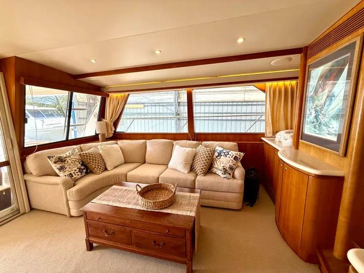 Yacht Photos Pics Luxurious interior of 2001 West Bay Sonship 58 Pilothouse yacht with plush seating and elegant decor.